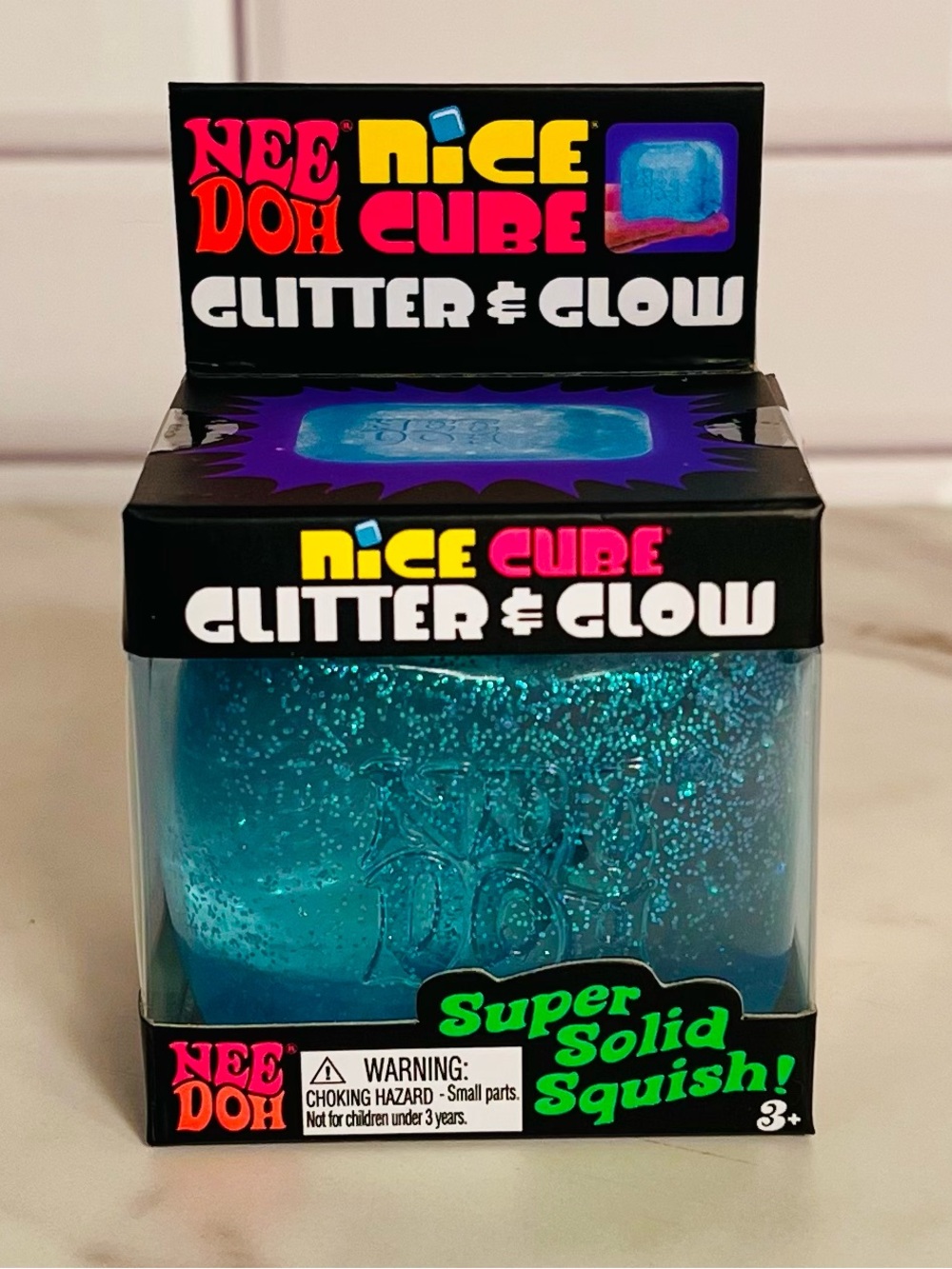 NeeDoh Nice Cube Glitter & Glow Blue Super Solid Squish Toy